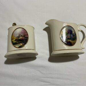 Avon Thomas Kinkade creamer and sugar set with golden spoon.